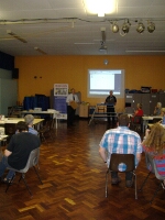 Larry Bill informing the group of what the Financial Investigation Unit does